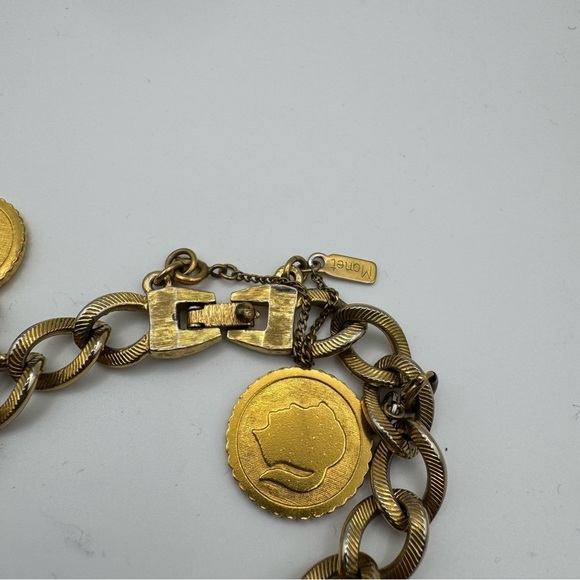 Vintage Monet Gold Tone Charm Bracelet with 9 Charms Easter Star Safety Chain - Picture 3 of 8